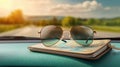 Sunglasses resting on a map inside a car, symbolizing outdoor adventure and exploration Royalty Free Stock Photo