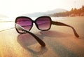 Sunglasses on the sand of Palolem beach Royalty Free Stock Photo