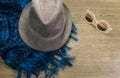 Sunglasses, Scarf and hat on wooden