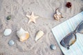 Sunglasses and Seashells on the sand. Flat lay composition with vacation accessories on beach