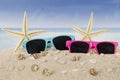 Sunglasses and starfish on beach Royalty Free Stock Photo