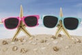 Sunglasses and starfish at the beach Royalty Free Stock Photo