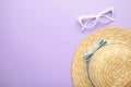 Sunglasses and striped retro haton purple background. Summer concept Royalty Free Stock Photo