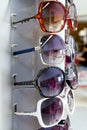 Sunglasses sun glasses stacked row in shop display Royalty Free Stock Photo