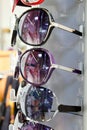 Sunglasses sun glasses stacked row in shop display Royalty Free Stock Photo