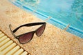 Sunglasses at the swimming pool of the hotel. Royalty Free Stock Photo