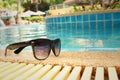 Sunglasses at the swimming pool of the hotel. Royalty Free Stock Photo