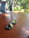 Sunglasses on the table. Royalty Free Stock Photo