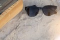 Sunglasses with text book on sand beach Royalty Free Stock Photo