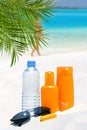 Sunglasses, water and sun protection cream Royalty Free Stock Photo