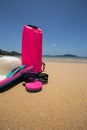 sunglasses, Waterproof bag, straw hat and flip flops on tropical Royalty Free Stock Photo