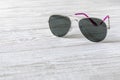 Sunglasses on a wooden table. Close up