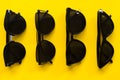 Sunglasses on Yellow background empty space