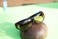 Sunglasses with yellow lenses special for driving. Shoot in a summer day outside closeup