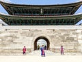 Three royal guards in Sungnyemun gate the fortress wall of Seoul