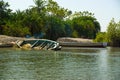 A sunken canoe on the River Gambia Royalty Free Stock Photo