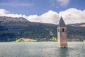 Sunken church tower in lake in the alps Royalty Free Stock Photo