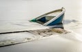 Sunken fishing boat in frozen lake water