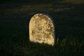 Sunken Gravestone at Sunset Royalty Free Stock Photo