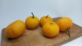 sunkist orange fruit on a wooden board with a sweet taste isolated on white