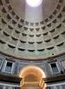 Sunlight beam coming through the dome oculus illuminating  the interior of the ancient temple Pantheon Royalty Free Stock Photo