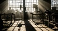 Sunlight beams through a window in a vintage workshop, illuminating machinery and benches Royalty Free Stock Photo