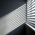 Sunlight Through Blinds Casting Shadows on Textured Wall Royalty Free Stock Photo
