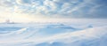 Sunlight breaks through cumulus clouds above a snowcovered landscape Royalty Free Stock Photo