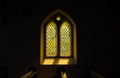 Sunlight casting colours through Gothic Stained glass window