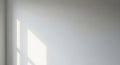 Sunlight Casting Geometric Shadows on a Plain White Wall window shadow Royalty Free Stock Photo