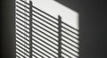 Sunlight Casting Shadow Patterns Through Window Blinds Royalty Free Stock Photo