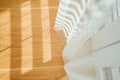 Sunlight casting soft shadows through sheer curtain