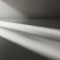 Sunlight casts diagonal shadows across a smooth, monochromatic surface, creating a pattern of light Royalty Free Stock Photo