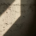 Sunlight casts a distinct diagonal shadow on a rough-textured concrete wall. The wall, Royalty Free Stock Photo