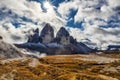 Sunlight on a cloudy day in Dolomites with a view of famous Tre Cime di Lavaredo