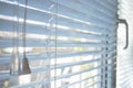 Sunlight coming through venetian blinds by the window Royalty Free Stock Photo
