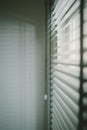 Sunlight coming on Venetian blinds by the window Royalty Free Stock Photo