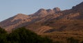 Early morning sunlight filters up a valley