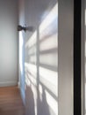 Sunlight,On door and wall,Color white,Shadow on light Royalty Free Stock Photo