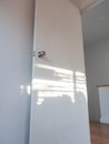 Sunlight,On door and wall,Color white,Shadow on light Royalty Free Stock Photo