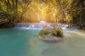 Sunlight effect over tropical water fall in deep forest Royalty Free Stock Photo