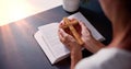 Sunlight Falling On Hand Over Bible