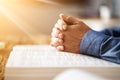 Sunlight Falling On Man's Hand Over Holy Bible Royalty Free Stock Photo