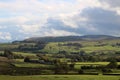 Sunlight, fields, fells near Greenholme, Cumbria