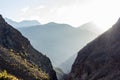 Sunlight filtering through the steep cliffs