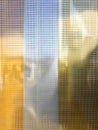 Sunlight Filtering Through Textured Glass in a Modern Building During Afternoon Hours Royalty Free Stock Photo