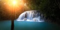 Sunlight in forest with waterfall Royalty Free Stock Photo