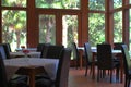 Sunlight on Garden Restaurant Tables and Chairs With Large Windows