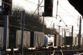 Sunlight glinting off containers on freight train on WCML Royalty Free Stock Photo