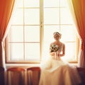 Sunlight highlights a bride while she seats in the front of a bi Royalty Free Stock Photo